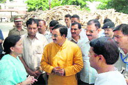 Chief Minister Ramesh Pokhriyal Nishank meets the relatives of the victims of a road accident in Haridwar on Monday. 