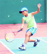 A player in action in the All-India Talent Series Tennis Tournament at Shanti Tennis Academy in Dehradun on Monday.