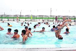 Children beat the heat at a swimming pool in Gymkhana Club, Rohtak