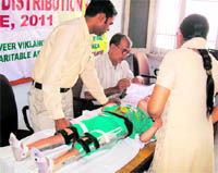 A patient from Jagadhri being provided an artificial limb at a camp in Yamunanagar