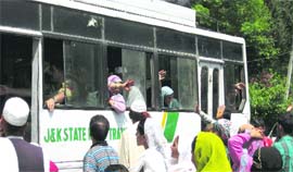 Members of the divided families bidding goodbye to their Pakistani relatives at sports stadium Poonch