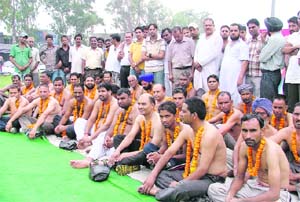 Activists of Dalit organisations sit on an indefinite hunger strike in Ludhiana on Monday. 