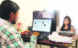 Fingerprints and eye colour of residents being scanned for unique identification cards in Ludhiana on Monday. 