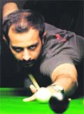 Rajat plays a shot during the state snooker championship at Sector 22 in Chandigarh