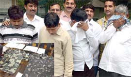 The accused in police custody in New Delhi on Tuesday. 