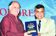 Union Minister of State for Home Affairs Gurudas Kamat is presented with a memento by JS Pandey, DGP, Uttarakhand, at the inauguration of the All-India Police Science Congress in Dehradun on Tuesday. 