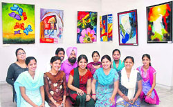 Fine art students of Government College, Hoshiarpur, are all smiles at their painting exhibition in Jalandhar.