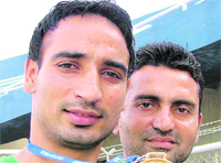 Satinder Singh along with his coach Sanjeev Sharma in Ludhiana