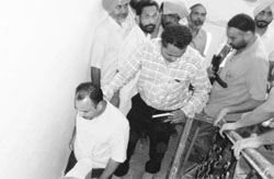 The accused being taken away by the Vigilance sleuths