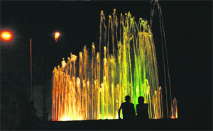 People enjoy the evening by the fountain at Sector 40 in Chandigarh.