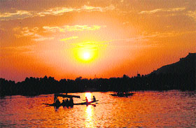 Boatmen ferry tourist on Dal Lake in Srinagar on Wednesday.
