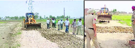 ll flat Municipal Corporation employees raze illegal structures in Ludhiana