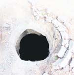 A manhole lies uncovered in the middle of the road connecting Shastri Nagar in Jagraon