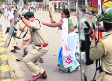 Krishak Mukti Sangram Samiti women activists beat up a police officer during a demonstration against eviction, in Guwahati on Wednesday. 