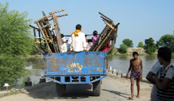 Tractor-trailers loaded with household goods will become a common sight at Mohar Jamsher village in the days ahead as monsoon sets in. This photo taken last year captures the travails of the villagers