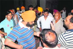 A Powercom official listens to residents at Zirakpur on Thursday night
