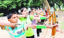 Sharp shooters: Budding archery players during a practice session at the Archery Coaching Centre in Lake Club, Chandigarh,