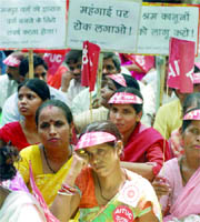 Activists of the All-India Trade Union Congress (AITUC) protest against the increasing prices of commodities and petrol, at Jantar Mantar in New Delhi on Thursday.