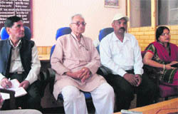 Panna Lal Surana (second from left) talks to mediapersons in Mussoorie on Thursday