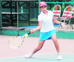 A player in action in the All-India Talent Series Tennis Tournament at Shanti Tennis Academy in Dehradun on Thursday. 