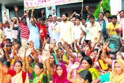 Residents of Chandi Ghat Majra stage a protest at the Haridwar muncipal office against the dumping of garbage near their colonies on Thursday