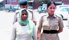 Surjo Devi, accused of killing her granddaughter Pooja (inset), is taken to a Sirsa court on Thursday.