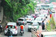Vehicles stand on the road due to a traffic jam in Shimla on Thursday.