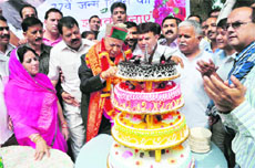 Virbhadra Singh cuts a cake on his 77th birthday in Shimla on Thursday.