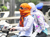 Women riding scooters while covering their faces can now get into trouble