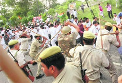Police lathicharge Youth Congress workers during their demonstration demanding CBI probe into the death of deputy CMO YS Sachan in Lucknow on Thursday.