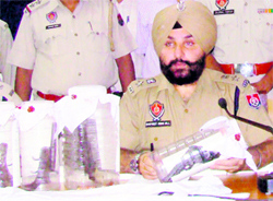 Patiala SSP Gurpreet Singh Gill shows the recovered ammunition at Patiala on Thursday
