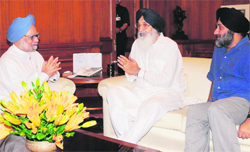 Chief Minister Parkash Singh Badal and Deputy Chief Minister Sukhbir Singh Badal with Prime Minister Manmohan Singh in New Delhi on Thursday