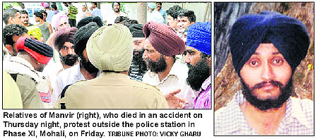 Relatives of Manvir (right), who died in an accident on Thursday night, protest outside the police station in Phase XI, Mohali, on Friday.