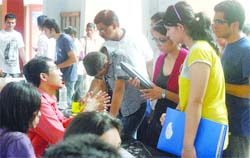 Students consult a helpdesk at Kirori Mal College in New Delhi 