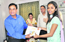SC Jarodia, Chief Postmaster General, gives award to a girl in Shimla 