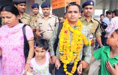 NK Sharma with his wife and children in New Delhi