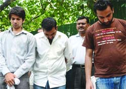 The accused in police custody.