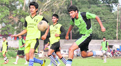 Players in action in a match in the Lala Nemi Dass Memorial District Football League Tournament at the Pavilion ground in Dehradun on Saturday. 