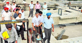 Punjab Pollution Control Board chairman KS Pannu (in blue turban) inspects the sewerage treatment plant at Bhattian village near Ludhiana on Saturday.