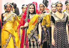 Sonakshi Sinha walks the ramp during IIFA awards 2011 in Toronto on Friday. Salman Khan action drama Dabangg and romantic comedy Band Baaja Baaraat scooped up three early honours each in the technical award category.