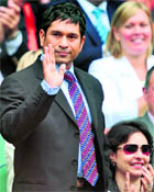 Sachin Tendulkar acknowledges the applause as he is introduced to the Centre Court crowd at Wimbledon on Saturday.