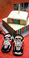 Faujas 100th birthday cake and his running shoes