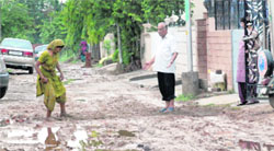  A muddy road has made it difficult for residents to venture out of their houses at Saini Vihar, Baltana, in Zirakpur.