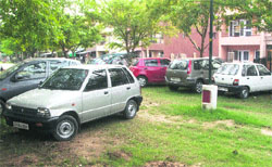 Vehicles parked in a park at Sector 40-C, Chandigarh. 