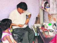 An unqualified doctor prepares to give a medicine to a child at Colony Number 4 in Chandigarh. 
