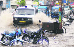 A road that turned into a virtual rivulet after heavy rain in Dehradun on Sunday. 