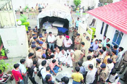 Congress activists stage a dharna against the eviction of MLA Kishore Upadhayaya in Dehradun on Sunday.