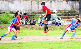 Players in action in a match in the Lala Nemi Dass Memorial District Football League at the Pavilion ground in Dehradun on Sunday.