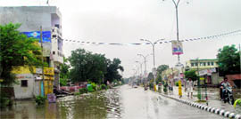 The rainwater-submerged road from Pehowa Chowk to the PWD resthouse in Kaithal on Sunday.