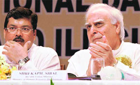 Union HRD Minister Kapil Sibal and Minister of Social Justice and Empowerment Mukul Wasnik at a function in New Delhi on Sunday.